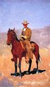 mounted_cowboy_in_chaps_with_race_horse-large.jpg